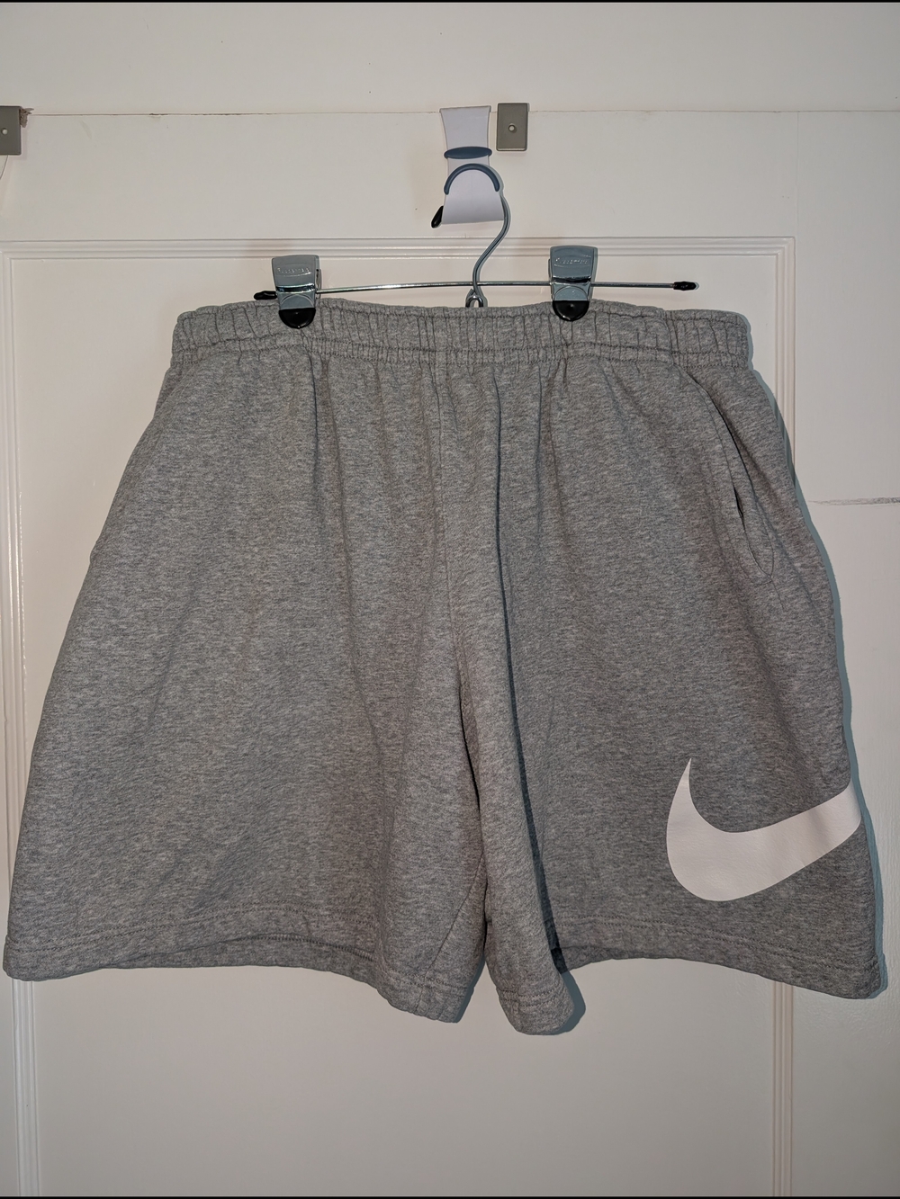 Men's Nike Gray Athletic Shorts with White Swoosh